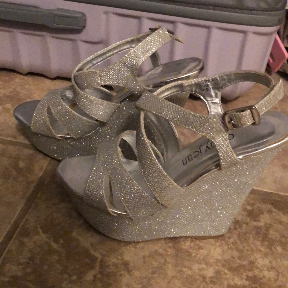 Get all the glitz and glamour with these shiny silver wedges from Cathy Jean!